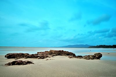 Scenic view of sea against blue sky