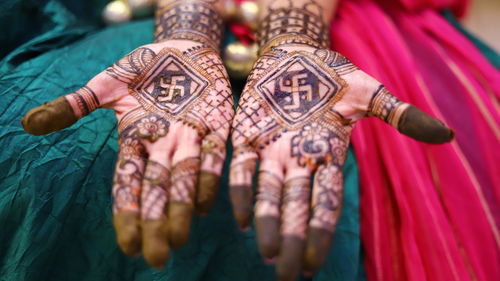 Close-up of woman hand with henna tattoo