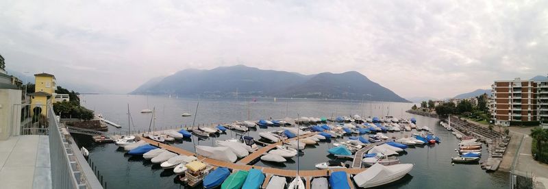 Panoramic view of boats moored in bay