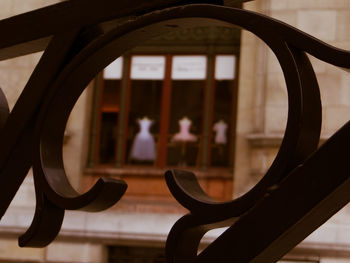Close-up of railing against window