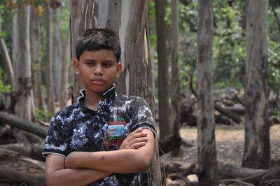 Portrait of boy in forest