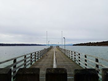 Pier over sea against sky