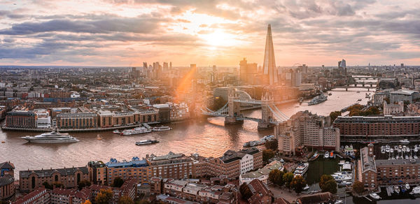 Aerial panoramic sunset view of london tower bridge and the river thames