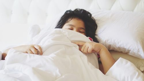 Girl lying on bed at home