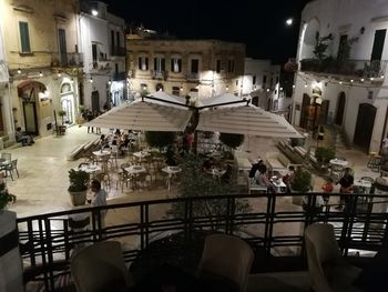 High angle view of people on street at night