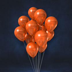Close-up of balloons against black background