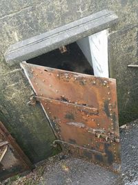 High angle view of rusty metal on field