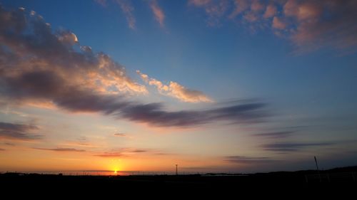Scenic view of silhouette landscape against sky during sunset