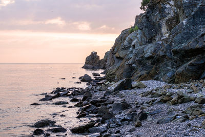 Beautiful rocky coastline in fethiye, turkey. sunset on a beach.