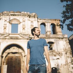 Man standing at historical building