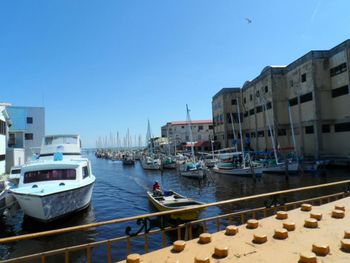 Boats moored at harbor