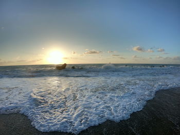 Scenic view of sea against sky during sunset