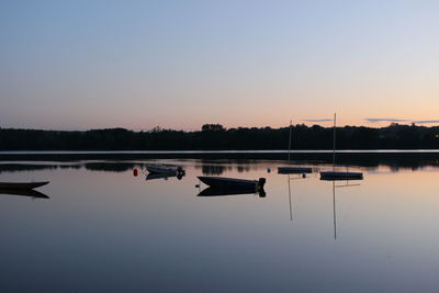 Scenic view of calm lake at sunset