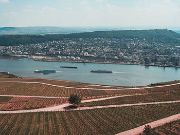 High angle view of river and cityscape against sky