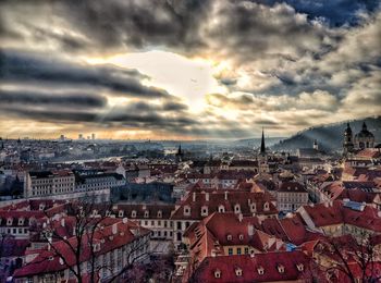 High angle view of cityscape against cloudy sky