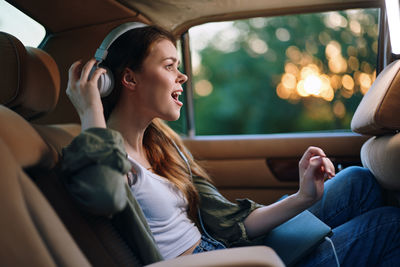 Friends sitting in car