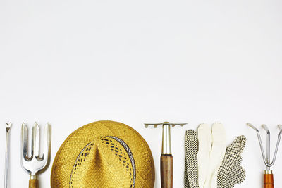 Directly above shot of objects on table against white background