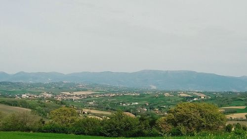 Scenic view of landscape and mountains against sky