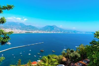 Panorama of the city of alanya on a summer day with a view of the coast, sea and yachts