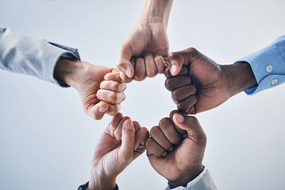 Cropped image of couple holding hands