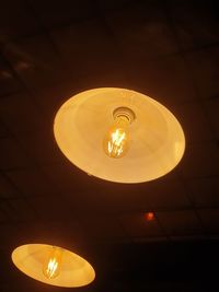 Low angle view of illuminated pendant light
