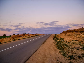 Road against sky during sunset