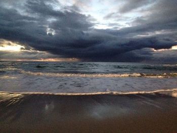 Scenic view of sea against cloudy sky