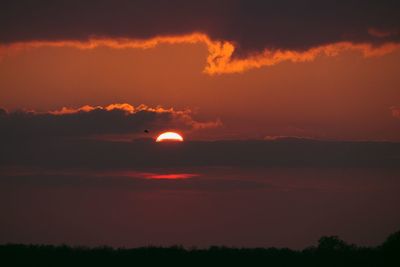 Scenic view of dramatic sky during sunset