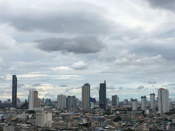 Modern buildings in city against sky