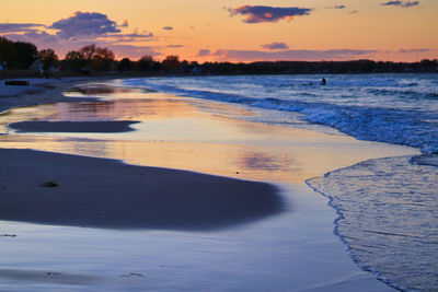 Scenic view of beach against sky during sunset