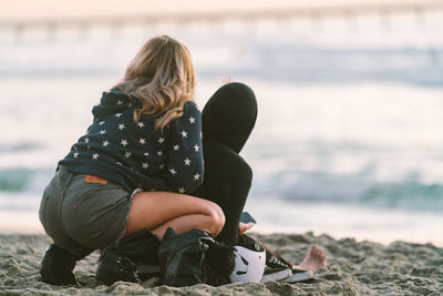 Rear view of women on beach