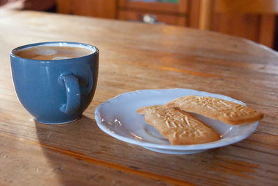 Close-up of coffee cup on table