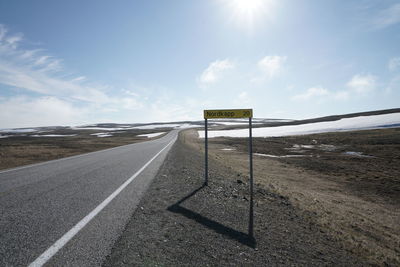 Road by land against sky