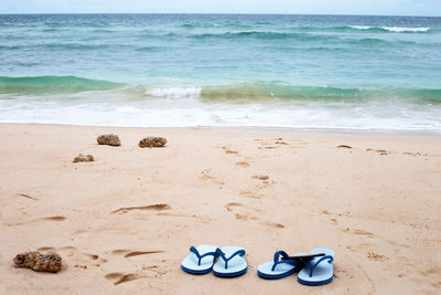 High angle view of shoes on beach