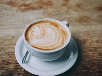 Close-up of cappuccino on table