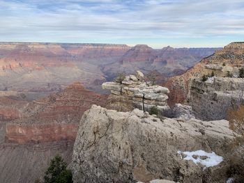 Scenic view of dramatic landscape against cloudy sky