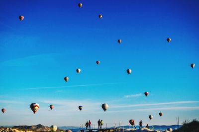 Hot air balloon flying in blue sky