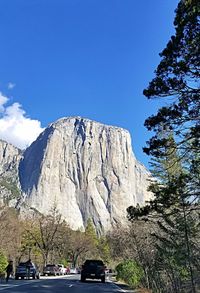 Scenic view of mountains against blue sky