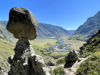  view of a mountain valley from stone mushrooms, water meadows and a river, chulyshman, altai, russia