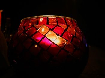 Close-up of illuminated lamp at night