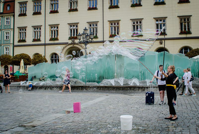 Group of people in front of building