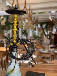 Close-up of hookah on table