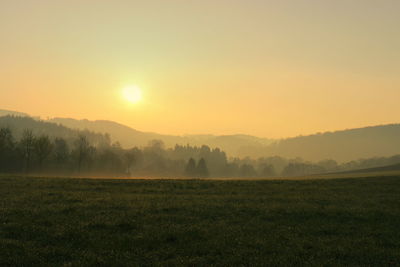 Scenic view of landscape at sunset