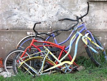 Bicycle parked in abandoned grass