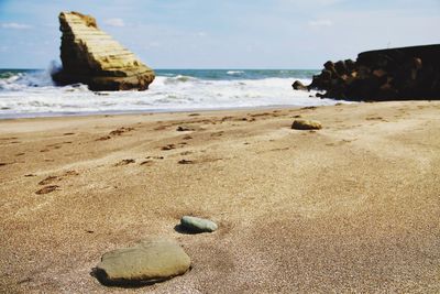 Scenic view of beach against sky