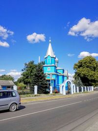 Buildings against blue sky and clouds