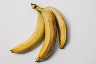 Close-up of bananas against white background