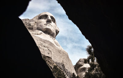 Low angle view of statue against sky