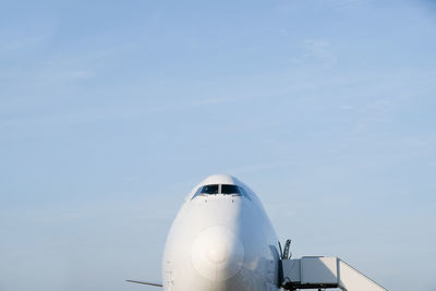 Low angle view of airplane against sky