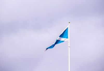 Low angle view of flag against sky